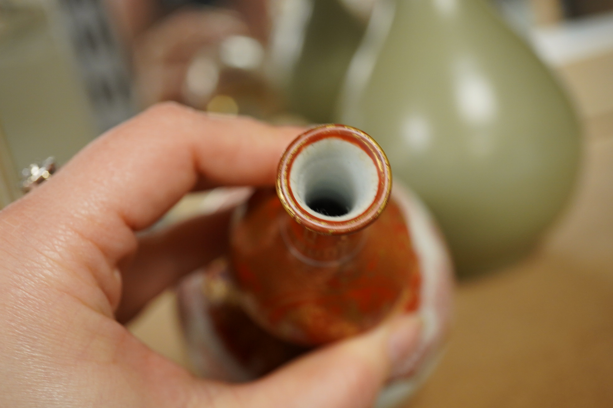 A Chinese celadon crackle glazed vase and a Japanese Kutani vase, tallest 22cm. Condition - good